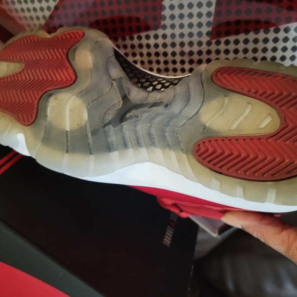 Air Jordan 11 Retro Red Athletic Sneakers.